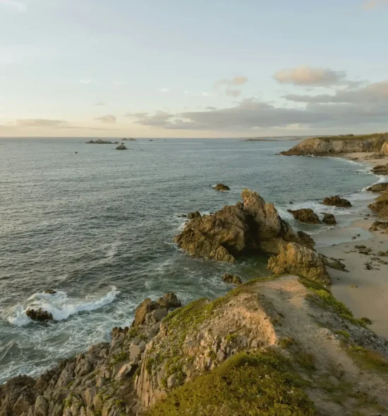 sehii-dominov-O1KqW4MPfM8-unsplash Rocky coastline overlooking the sea at sunset